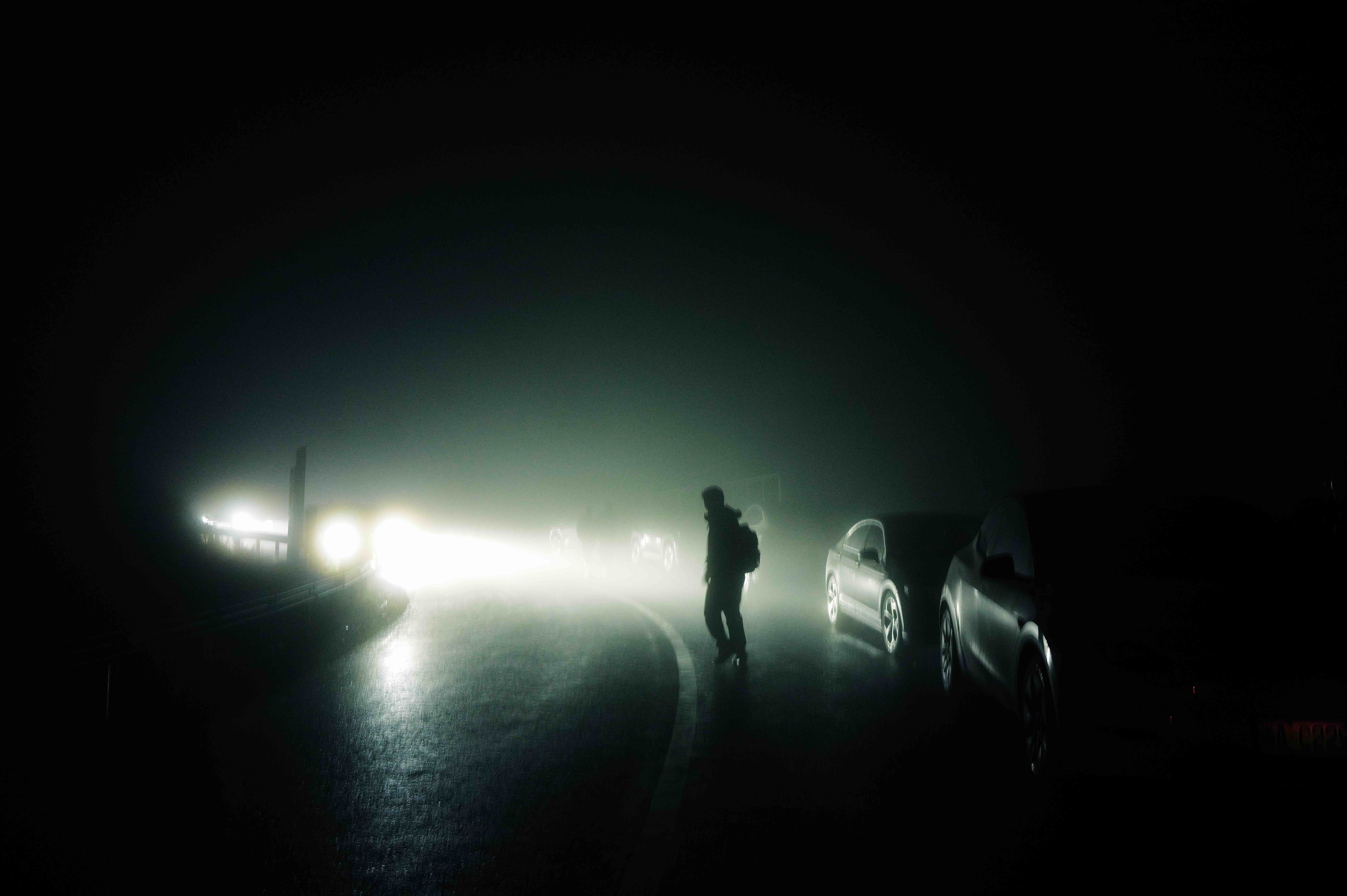 Parked cars in dense fog
